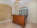 Stylish bar area with custom wood finish and ample storage at 336 Highcroft Ct, Lake Mary, FL 32746