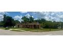 Wide angle street-view featuring a well-kept lawn and a single-story house at 385 Lynchfield Ave, Altamonte Springs, FL 32714