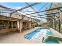 Spacious screened-in pool area with ample seating and room for entertaining guests at 7621 Brightwater Pl, Oviedo, FL 32765