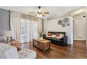 Open concept living room with modern decor and plenty of natural light, great for entertaining at 857 Marquis Ct, Kissimmee, FL 34759