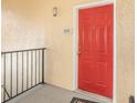Close-up of a bright red front door with unit number 5308 on a sunny day at 1125 Lake Shadow Cir # 5308, Maitland, FL 32751