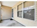 Enclosed patio space with neutral siding, providing a serene outdoor area at 17097 Se 96Th Chapelwood Cir, The Villages, FL 32162