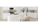 Modern kitchen featuring white cabinets, stainless steel appliances, a breakfast bar, and ample counter space at 1993 Beach Ter, Celebration, FL 34747