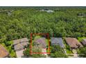 Aerial view of the property showing the house, surrounding trees, and neighborhood at 2274 Foliage Oak Ter, Oviedo, FL 32766