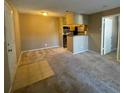 Inviting living area featuring neutral paint, plush carpeting, and an open layout to the kitchen at 236 Afton Sq # 207, Altamonte Springs, FL 32714