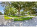 Well-maintained property on a corner lot with lush landscaping and mature trees providing shade at 2782 Cedar Knoll Dr, Apopka, FL 32712