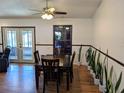Inviting dining room featuring a wooden table, chair set and a view to the outdoor space at 3021 Norvell Ct, Deltona, FL 32738