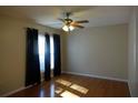 Bedroom has wood floors, natural light and a ceiling fan at 3024 S Semoran Blvd # 7, Orlando, FL 32822