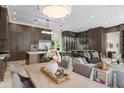 Modern kitchen with stainless steel appliances, a large island, and adjacent wine bar at 3426 Cocard Ct, Windermere, FL 34786