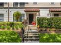 Well-manicured front entrance with steps leading to the front door and lush landscaping at 3508 Porta Romano Way, Lake Mary, FL 32746