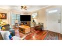 Comfortable living room with hardwood floors and neutral walls, creating a cozy and welcoming atmosphere at 4890 Conway Rd # 66, Orlando, FL 32812