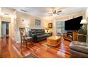 Comfortable living room with hardwood floors, modern furnishings, and a ceiling fan at 4890 Conway Rd # 66, Orlando, FL 32812