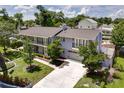 Spacious two-story home with a large driveway, well-maintained lawn, and mature trees at 503 Savona Ct, Altamonte Springs, FL 32701