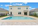 An inviting backyard pool features patio and views, perfect for enjoying sunny days and outdoor entertaining at 6808 Cranes Roost Rd, Harmony, FL 34773