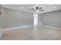 Open-concept room with light tile flooring, neutral walls, and plenty of natural light at 811 Osceola Trl, Casselberry, FL 32707