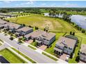 Two-story home with manicured lawn, screened in patio, close to community amenities and lush surroundings at 9128 Sonoma Coast Dr, Winter Garden, FL 34787