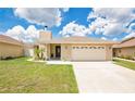 Attractive one-story home with a brick-accented facade and a two-car garage at 1166 Mapimi Ct, Winter Springs, FL 32708