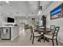 Open-concept living area featuring tile floors, neutral paint, and modern furnishings at 1191 Honey Blossom Dr # D, Orlando, FL 32824