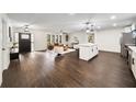 Spacious open-concept living room with wood floors, lots of seating, and natural light at 1523 N Beach St, Ormond Beach, FL 32174