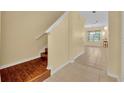 The light-filled staircase leads to the second level of the house, and to the living area at 1534 Barking Deer Cv, Casselberry, FL 32707