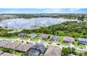 Aerial view of homes and a lake, with a red pin highlighting the property's location at 16412 Good Hearth Blvd, Clermont, FL 34711