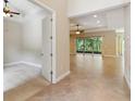 Bright, expansive living area with tiled floors, high ceilings, and sliding glass doors leading to the outdoors at 207 Spalding Way, Deland, FL 32724
