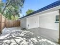 View of the large, newly painted carport and fenced yard with a storage shed at 3321 Mahalia Pl, Orlando, FL 32805