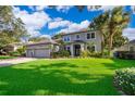 Stunning two-story home with a well-maintained lawn, mature trees, and a spacious three-car garage at 394 Baymoor Way, Lake Mary, FL 32746