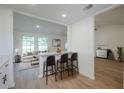 Features a breakfast bar separating the kitchen from the living space at 4800 Reginald Rd, Orlando, FL 32829