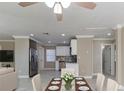 Bright and open kitchen and dining area featuring modern stainless steel appliances at 4933 Balboa Dr, Orlando, FL 32808