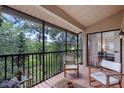 Relaxing screened-in porch with views of the natural landscaping at 7742 Sugar Bend Dr # 7742, Orlando, FL 32819