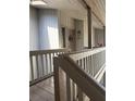 Inviting balcony area featuring unit 116 with wood railings at 116 Palm View Ct # 3535/6, Haines City, FL 33844