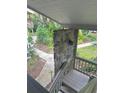 Charming exterior view featuring a stone pillar and landscaped walkways at 116 Palm View Ct # 3535/6, Haines City, FL 33844