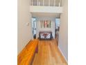 Welcoming foyer with hardwood floors and decorative bench at 116 Palm View Ct # 3535/6, Haines City, FL 33844