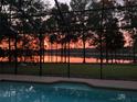 Enjoy tranquil water views and stunning sunsets from this screened-in pool at 21795 Sw 88Th Lane Rd, Dunnellon, FL 34431