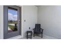 Inviting front porch with a stylish chair and small table, creating a welcoming entryway at 3304 Wye Oak Dr, Apopka, FL 32703