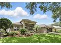 Stunning one-story home featuring manicured landscaping, a tile roof and an attached two-car garage at 387 Devon Pl, Lake Mary, FL 32746