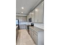 Stylish kitchen showcasing granite countertops and modern stainless steel appliances at 483 Shadow Gorge Way, Eustis, FL 32736