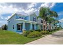 Well-maintained home with a manicured lawn, vibrant landscaping, and a sidewalk-lined street at 7530 Summerlake Groves St, Winter Garden, FL 34787