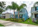 Attractive two-story home with a well-kept lawn, mature trees, and a neatly trimmed landscape at 7530 Summerlake Groves St, Winter Garden, FL 34787