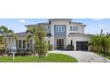 Beautiful two-story home features modern design, manicured lawn, and a welcoming entrance at 9156 Sheen Sound St, Orlando, FL 32836