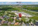 Aerial view of the house in community near SR 417 with mature trees at 10142 Serotina Ct, Orlando, FL 32832