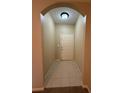 View of a well-lit entryway featuring neutral paint and tile flooring at 12016 Villanova Dr # 102, Orlando, FL 32837