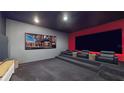 Home theater featuring tiered seating, a massive screen, and cozy black leather chairs at 14124 Dove Hollow Dr, Orlando, FL 32824
