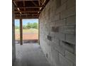 Interior of home under construction with concrete floors, unfinished block walls, and wood framing at 1635 Cane Bamboo Drive, St Cloud, FL 34771