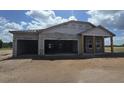 View of home in progress with visible block walls and partial roof construction at 1635 Cane Bamboo Drive, St Cloud, FL 34771