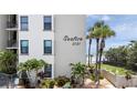 Landscaped condominium building near the beach, featuring decorative shrubbery at 2121 Hill St # 7B, New Smyrna Beach, FL 32169