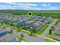 Aerial view of a residential area showcasing well-maintained homes and landscaping at 1378 Roxy Ln, Winter Garden, FL 34787