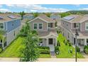 Two-story home in residential area with well-manicured lawn and covered front porch at 1378 Roxy Ln, Winter Garden, FL 34787