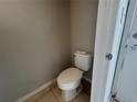 Small bathroom with a toilet and beige walls at 1922 Conway Rd # 1922, Orlando, FL 32812